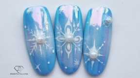 Aurora Mirror Chrome snowflakes nail art. Winter nail design.