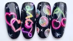 Glowing neon sign nail art. Rainbow bubbles nail art.