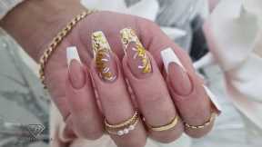 White and gold embossed nail art. Filigree nail art design. Fremch manicure